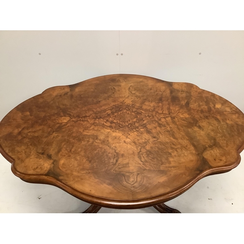 1163 - A Victorian burr walnut shaped oval tilt top loo table with quarter veneered top, width 146cm, depth... 