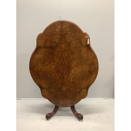 1163 - A Victorian burr walnut shaped oval tilt top loo table with quarter veneered top, width 146cm, depth... 