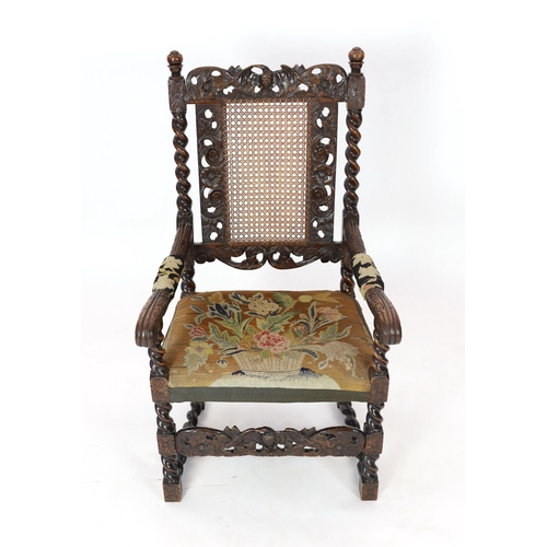 1175 - * * A Charles II carved walnut caned back elbow chair, with a contemporary needlework upholstered se... 