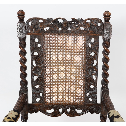 1175 - * * A Charles II carved walnut caned back elbow chair, with a contemporary needlework upholstered se... 