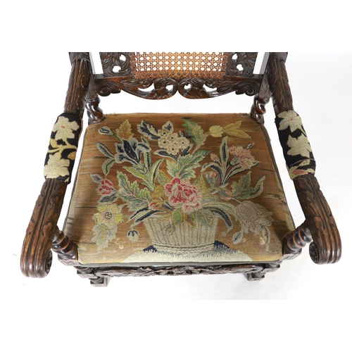 1175 - * * A Charles II carved walnut caned back elbow chair, with a contemporary needlework upholstered se... 