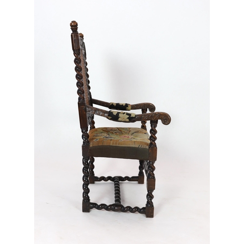 1175 - * * A Charles II carved walnut caned back elbow chair, with a contemporary needlework upholstered se... 