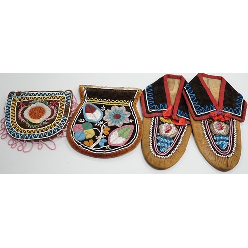 1328 - A pair of mid to late 19th century North American Indian moccasins, worked in floral beadwork on vam... 