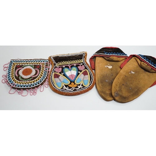 1328 - A pair of mid to late 19th century North American Indian moccasins, worked in floral beadwork on vam... 