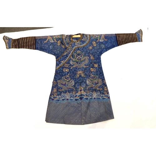 1340 - A Chinese fine blue gauze summer robe embroidered with a gold thread dragon highlighted by coloured ... 