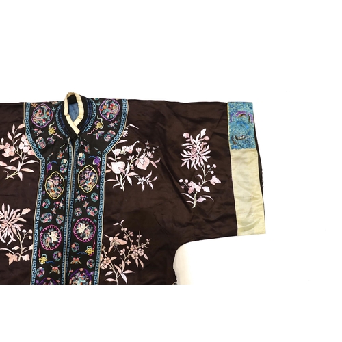 1341 - A Chinese early Republic blue silk embroidered robe with colourful ornately embroidered sleeve bands... 