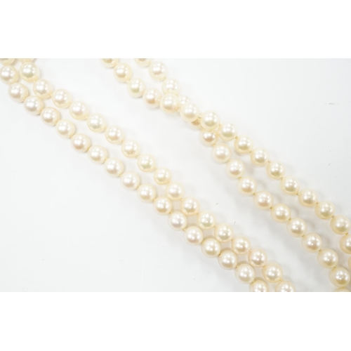 2005 - A double strand cultured pearl choker necklace with yellow and white metal, ruby and diamond cluster... 