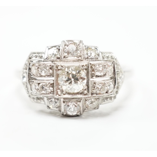 2010 - An Art Deco style white metal and millegrain set diamond cluster ring, size N/O, gross weight 4.1 gr... 