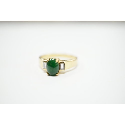 2012 - A 750 yellow metal, single stone cabochon jade and two stone baguette cut diamond set ring, size M, ... 