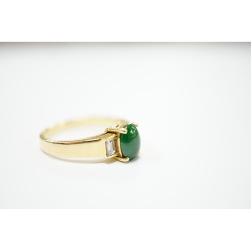 2012 - A 750 yellow metal, single stone cabochon jade and two stone baguette cut diamond set ring, size M, ... 