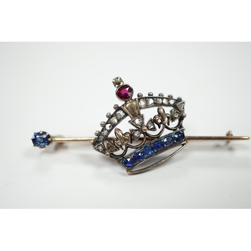 2014 - An Edwardian yellow metal, ruby, sapphire and rose cut diamond set coronet bar brooch, 50mm, gross w... 