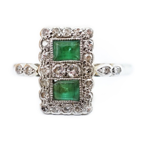 2017 - An Art Deco white metal, emerald and diamond set double cluster tablet ring, with diamondset shoulde... 