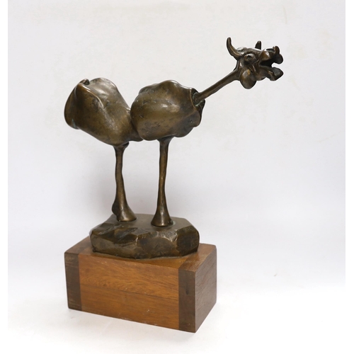 257 - An abstract bronze model of a cow, 34cm