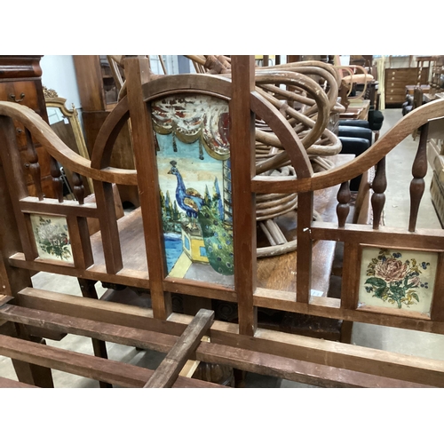 45 - A 19th century Zanzibar hardwood bedframe inset reverse painted glass panels of peacocks and vases o... 