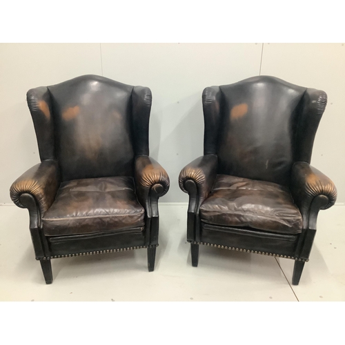 61 - A pair of Victorian style brown leather wing armchairs, width 78cm, depth 88cm, height 106cm