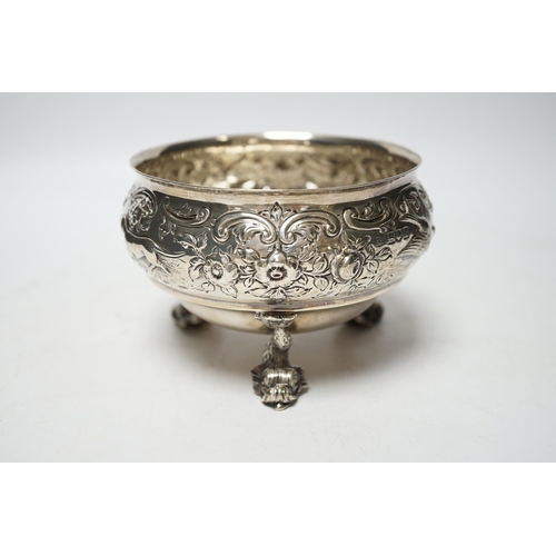 845 - An Edwardian embossed silver bowl, on three dolphin supports, Wakely & Wheeler, London, 1905, diamet... 