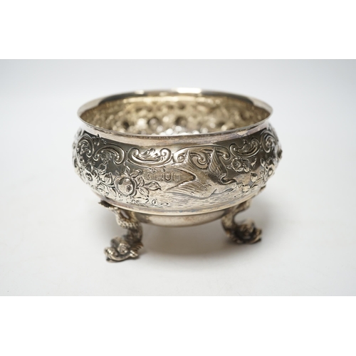 845 - An Edwardian embossed silver bowl, on three dolphin supports, Wakely & Wheeler, London, 1905, diamet... 