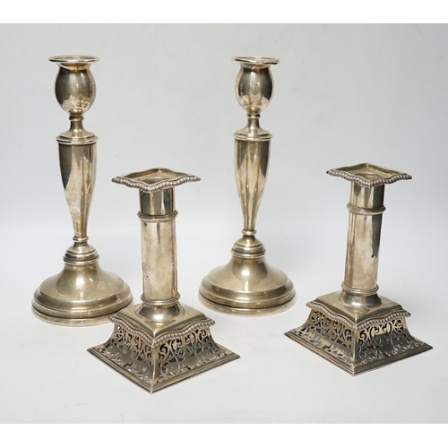 846 - A pair of Victorian silver candlesticks, on pierced swept bases, William Leuchars, London, 1886, 15.... 