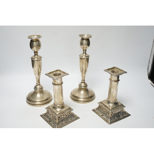 846 - A pair of Victorian silver candlesticks, on pierced swept bases, William Leuchars, London, 1886, 15.... 