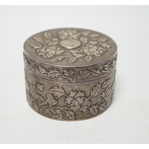 853 - An early 20th century Chinese white metal circular box and cover, maker's mark MK, with foliate deco... 