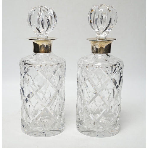 856 - A modern pair of silver mounted cut glass cylindrical decanters with stoppers, Birmingham, 1971/73, ... 