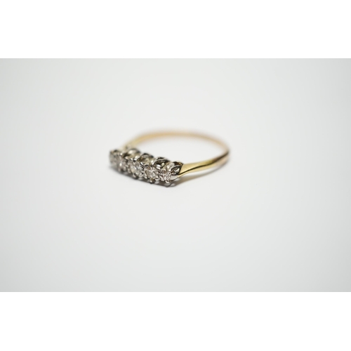 900 - A yellow metal  and graduated five stone diamond set half hoop ring, size M, gross weight 2 grams.... 