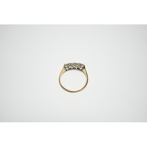 900 - A yellow metal  and graduated five stone diamond set half hoop ring, size M, gross weight 2 grams.... 