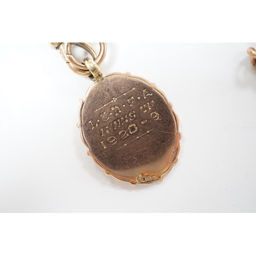 903 - A 9ct gold albert, 38cm, hung with a 9ct gold and enamel football related medal engraved 'L .&. D F.... 