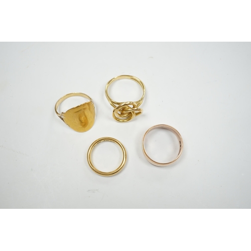 904 - A 1930's 22ct gold wedding band, 5.9 grams, a 9ct gold wedding band, 5.1 grams and two other yellow ... 