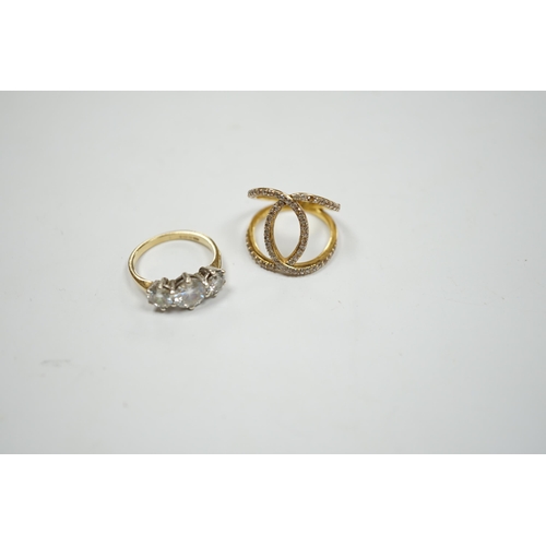 905 - A 9ct gold and three stone simulated diamond ring and a gilt 925 ring.