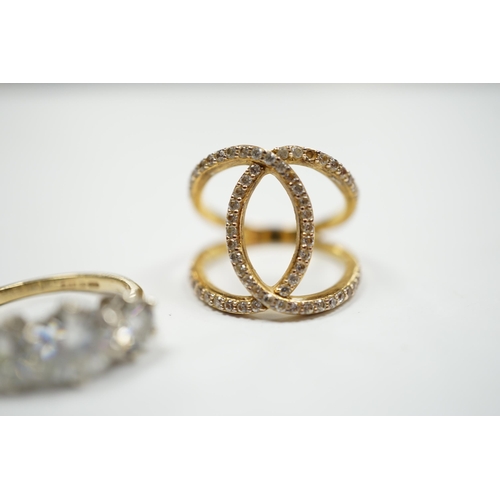 905 - A 9ct gold and three stone simulated diamond ring and a gilt 925 ring.