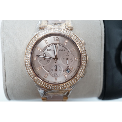 914 - A lady's modern gilt steel and simulated diamond set Michael Kors chronograph quartz watch, with box... 