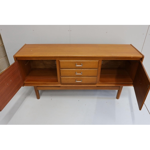 1013 - A mid century teak sideboard, bears William Lawrence label, width 163cm, depth 44cm, height 77cm... 