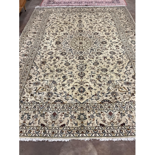 1040 - A Kashan ivory ground carpet, 348 x 244cm