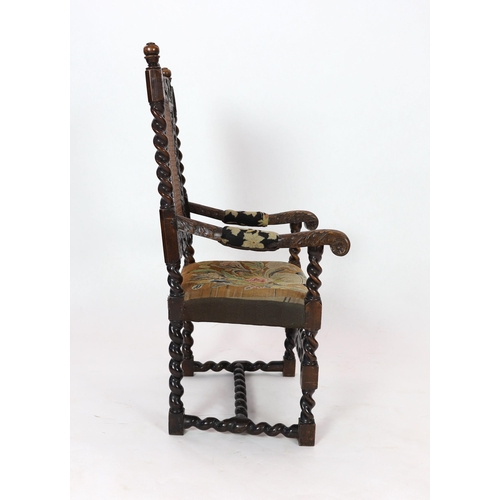 1051 - * * A Charles II carved walnut caned back elbow chair, with a contemporary needlework upholstered se... 