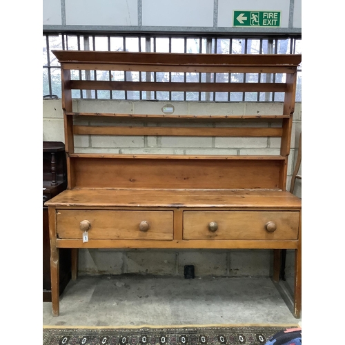 1072 - An early 19th century pine dresser with associated rack, width 184cm