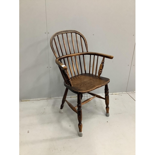 1086 - A mid 19th century Windsor elm and beech comb back elbow chair, width 62cm, depth 38cm, height 98cm... 