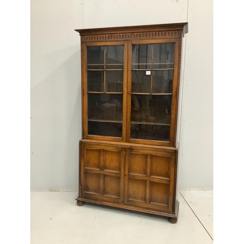 1098 - An early 20th century Jacobean revival oak bookcase, width 106cm, depth 31cm, height 183cm