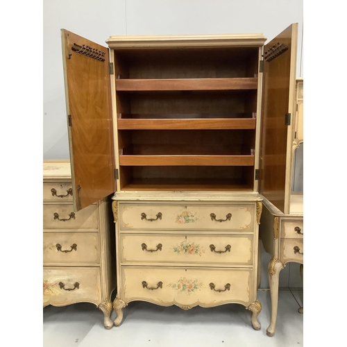 1101 - An 18th century style painted seven piece bedroom suite, comprising press cupboard, pair of bedside ... 