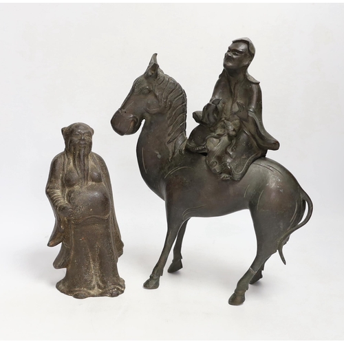 1331 - Two Chinese bronze figures; a luohan on his mule and a figure of a wise man, tallest 30cm