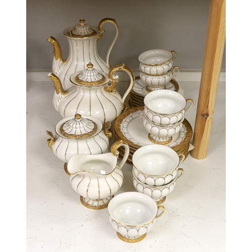 1333 - A Meissen gilt and white glazed porcelain tea service, mid 20th century, comprising a teapot, coffee... 