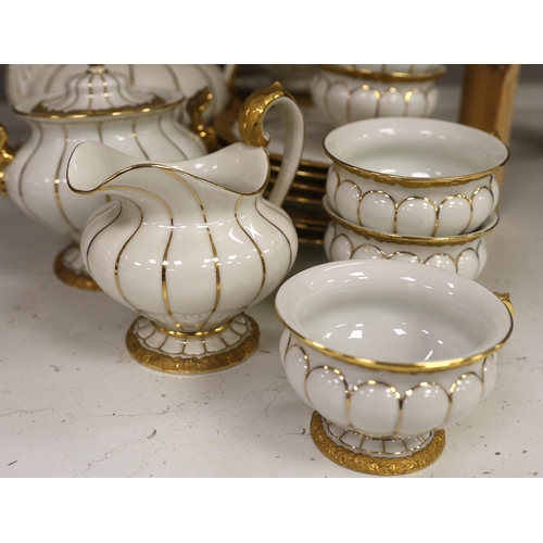 1333 - A Meissen gilt and white glazed porcelain tea service, mid 20th century, comprising a teapot, coffee... 