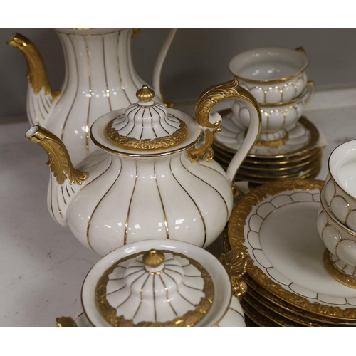 1333 - A Meissen gilt and white glazed porcelain tea service, mid 20th century, comprising a teapot, coffee... 