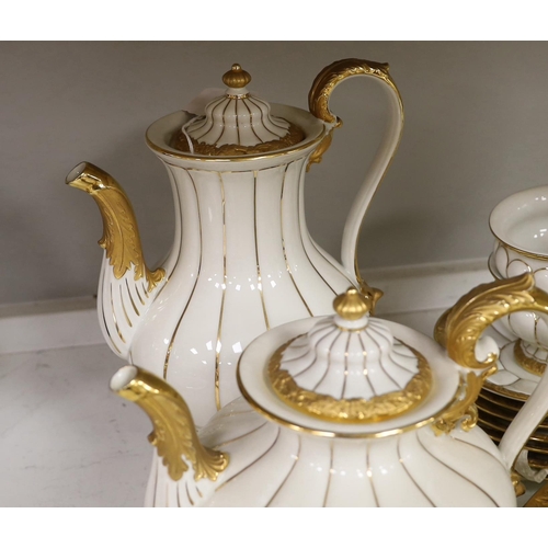 1333 - A Meissen gilt and white glazed porcelain tea service, mid 20th century, comprising a teapot, coffee... 