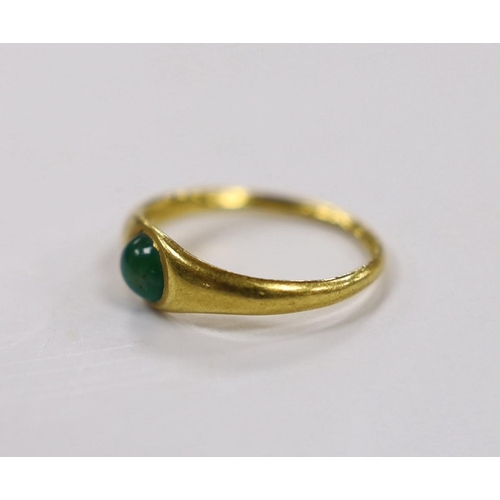 1895 - A Roman high carat yellow metal and single stone cabochon emerald set ring, size L, gross weight 3.7... 