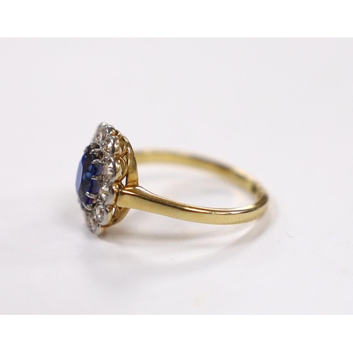 1898 - A 1940's/1950's 18ct, sapphire and millegrain set diamond oval cluster ring, size L/M, gross weight ... 