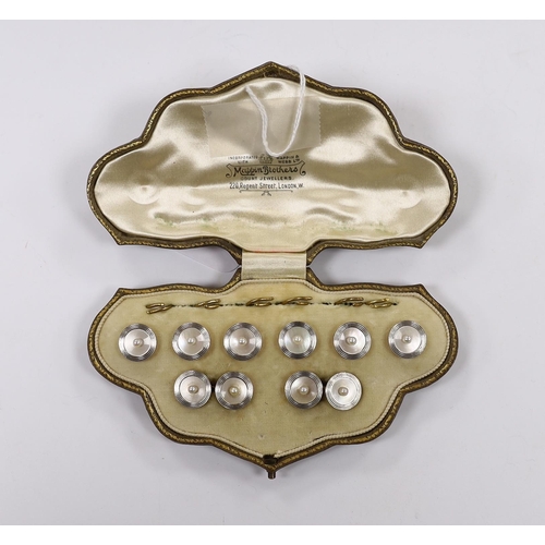 1908 - An early to mid 20th century 18ct, mother of pearl and seed pearl set eight piece dress stud set, in... 