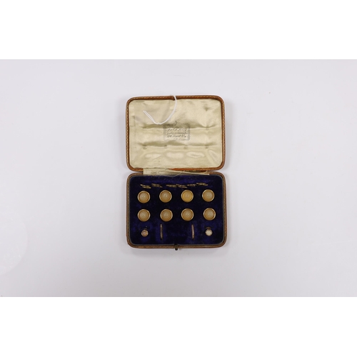 1909 - An early 20th century 9ct and chalcedony set ten piece dree stud set, in fitted gilt tooled leather ... 