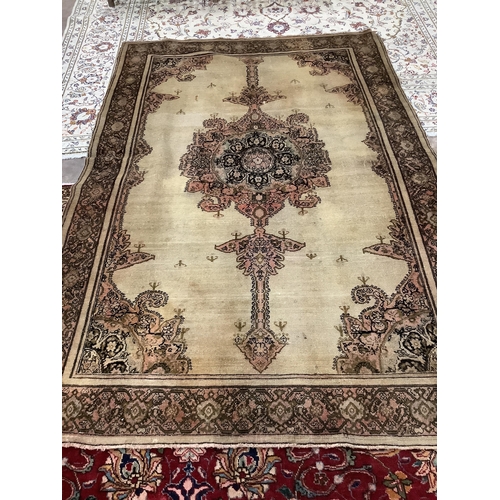 1099 - A Malayan ivory ground rug, 210 x 138cm