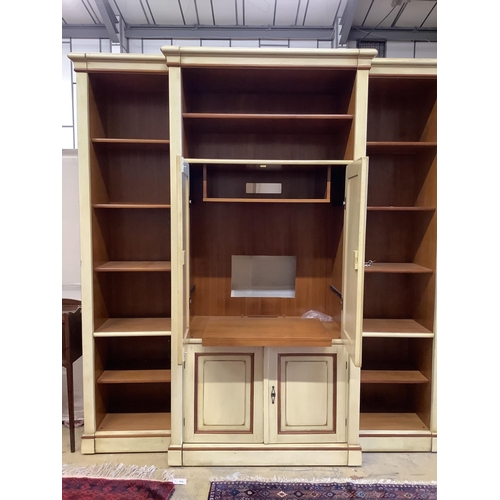 104 - A reproduction Continental painted breakfront bookcase / media cabinet, width 204cm, depth 55cm, hei... 